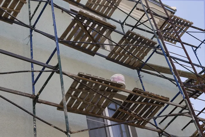 Framed Print : Facade of a residential building in scaffolding Framed Print : Facade of a residential building in scaffolding