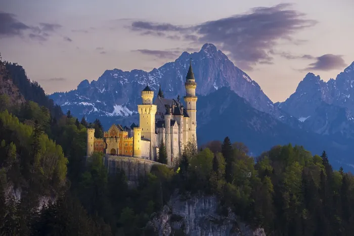 Framed Print : Fairytale castle against a mountain backdrop in the soft evening light