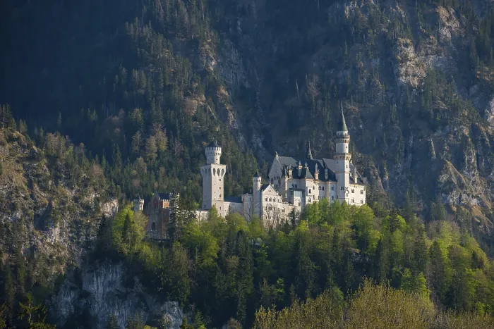 Framed Print : Fairytale Neuschwanstein Castle nestled in wooded mountains