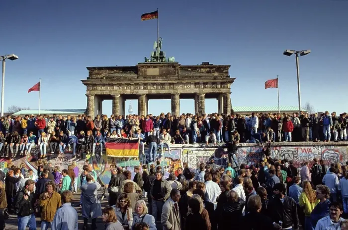 Framed Print : Fall of the Berlin Wall: people from East and West Berlin climbing on the Wall at the Brandenburg Gate, Berlin, Germany, Europe
