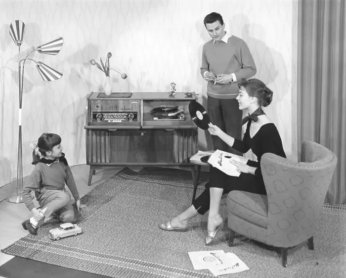 Framed Print : Family in the living room in front of the stereo Framed Print : Family in the living room in front of the stereo