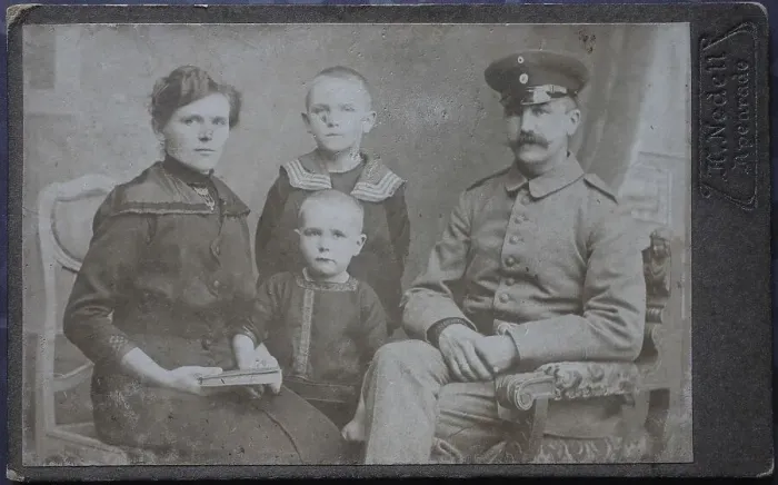 Framed Print : Family, man in uniform, woman and two boys Framed Print : Family, man in uniform, woman and two boys