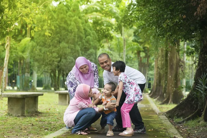 Framed Print : Family playing at outdoor garden park