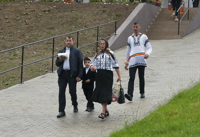 Framed Print : Family in traditional dress on a cosy walk