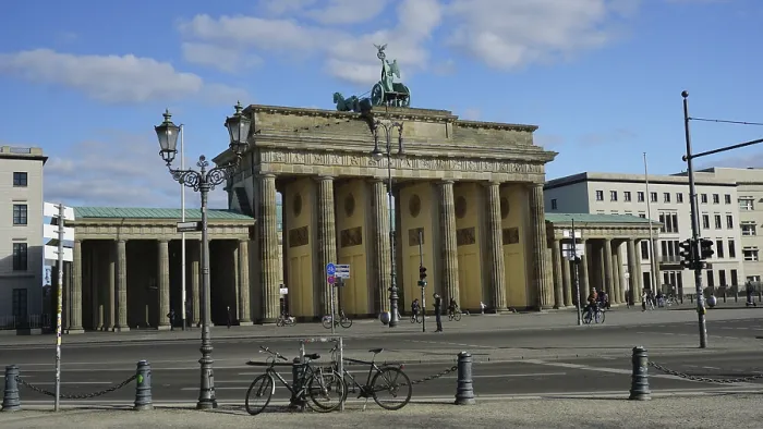 Framed Print : Famous gate in Berlin, Brandenburg Gate with a few bicycles in the foreground and blue sky Framed Print : Famous gate in Berlin, Brandenburg Gate with a few bicycles in the foreground and blue sky
