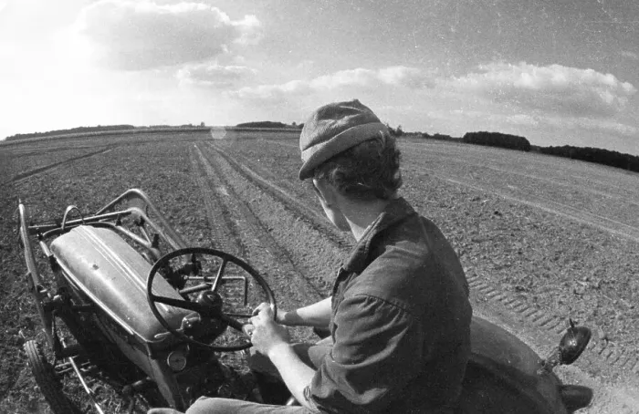 Framed Print : Farmers working in the fields in Muensterland on 10