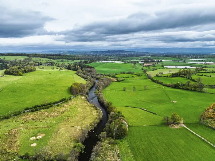 Framed Print : Farms and mountains over Ullswater Lake from drone