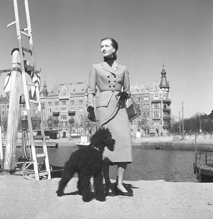 Framed Print : Fashionable in the 1950s. A young woman is wearing a typical 1950s coat Framed Print : Fashionable in the 1950s. A young woman is wearing a typical 1950s coat