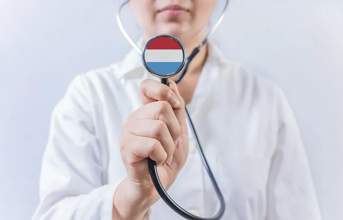 Framed Print : Female doctor holding stethoscope with Luxembourg flag Framed Print : Female doctor holding stethoscope with Luxembourg flag