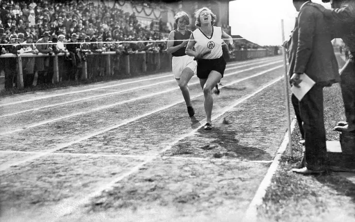 Framed Print : Two female runners at the finish line