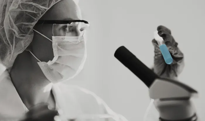 Framed Print : Female scientist working with test tubes in lab