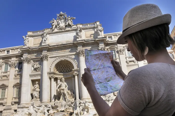 Framed Print : Female tourist with a map, in front of Trevi Fountain
