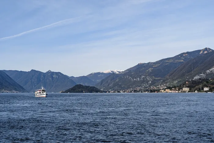 Framed Print : Ferry sails on Lake Como with mountains in the background