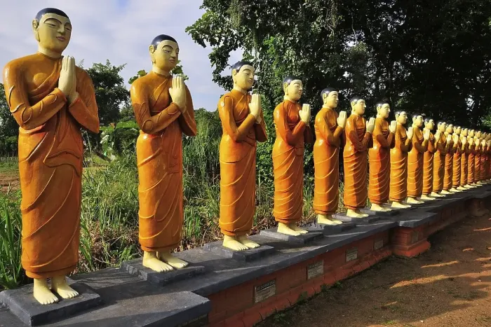 Framed Print : Figures of Buddhist nuns, outside a monastery Framed Print : Figures of Buddhist nuns, outside a monastery