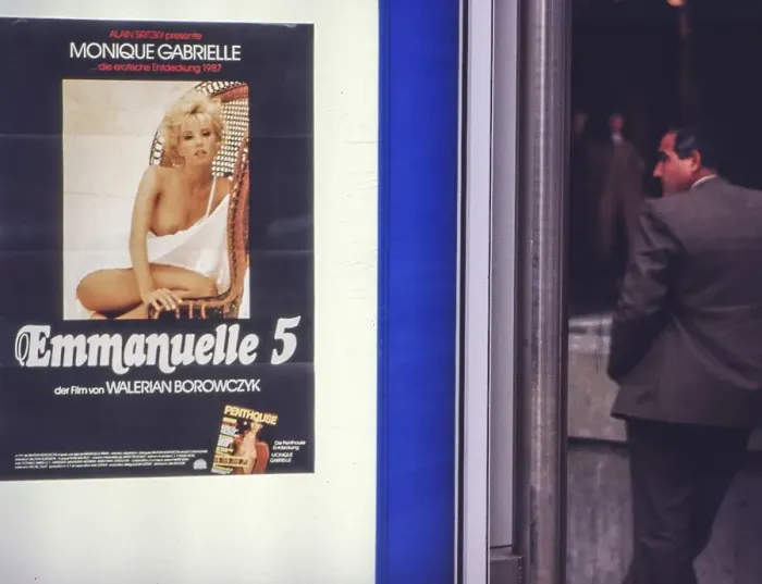 Framed Print : Film poster Emmanuelle 5 with Monique Gabrielle from 1987 in front of a sex cinema in the Hindenburg building