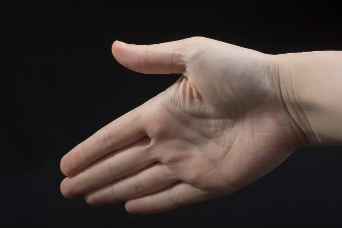 Framed Print : Five fingers of a child hand partly seen in black background