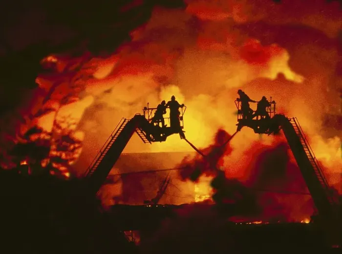 Framed Print : Firefighters extinguish a fire
