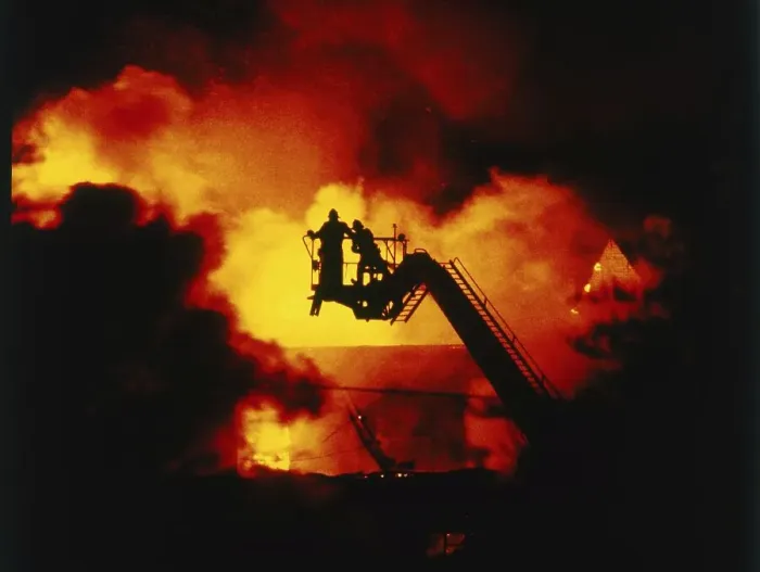 Framed Print : Firefighters extinguish a fire