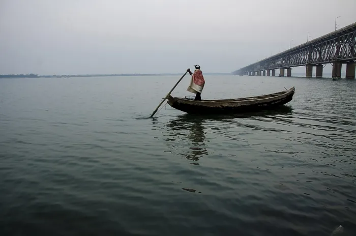 Framed Print : Fisherman in boat, rajahmundry