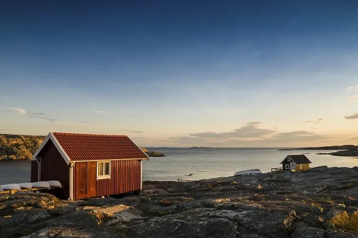 Framed Print : Fisherman's cottage by the sea at sunset Framed Print : Fisherman's cottage by the sea at sunset