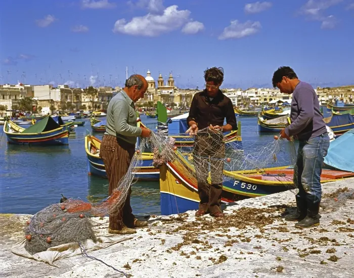 Framed Print : Fishermen checking their nets, harbour of Marsaxlokk, Malta, Europe