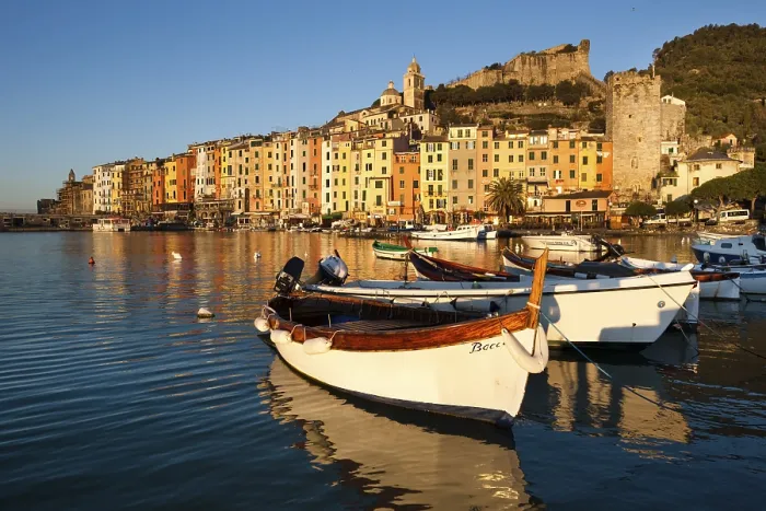 Framed Print : Fishing boats in the harbour in front of the historic town centre of Porto Venere