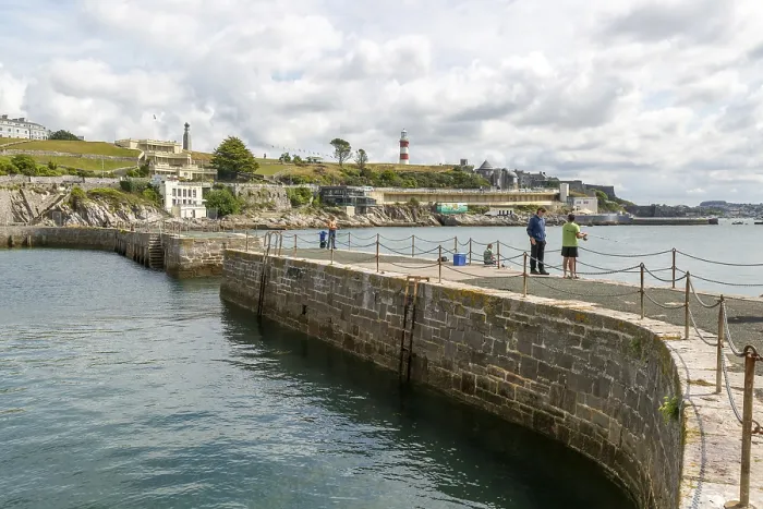 Framed Print : Fishing from harbour wall, seafront coastline waterfront