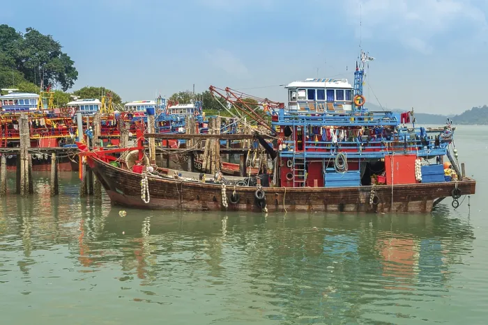 Framed Print : Many fishing trawler are moored in the harbor of the small town Pekan Pangkor on the island of Pangkor on the west