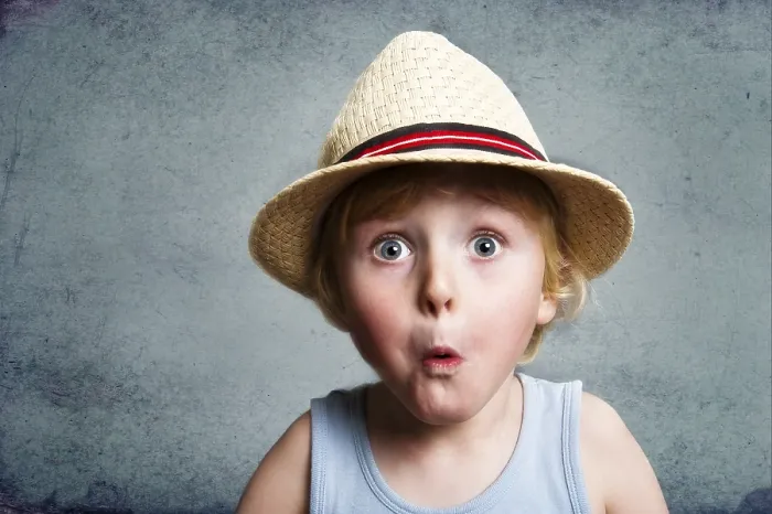 Framed Print : Five-year-old boy wearing a hat