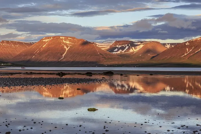 Framed Print : Fjord, low tide, stones, mountains reflected in the water