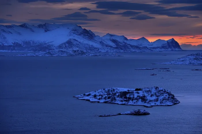 Framed Print : Fjord with mountains in winter at sunset