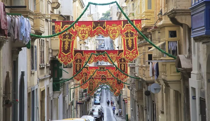 Framed Print : Flags decorate historic street in city centre of Valletta