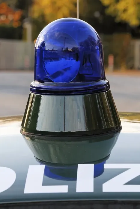 Framed Print : Flashing light and lettering at a historic patrol car of the German police
