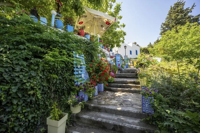 Framed Print : Flower-lined path, alley in the village of Zia