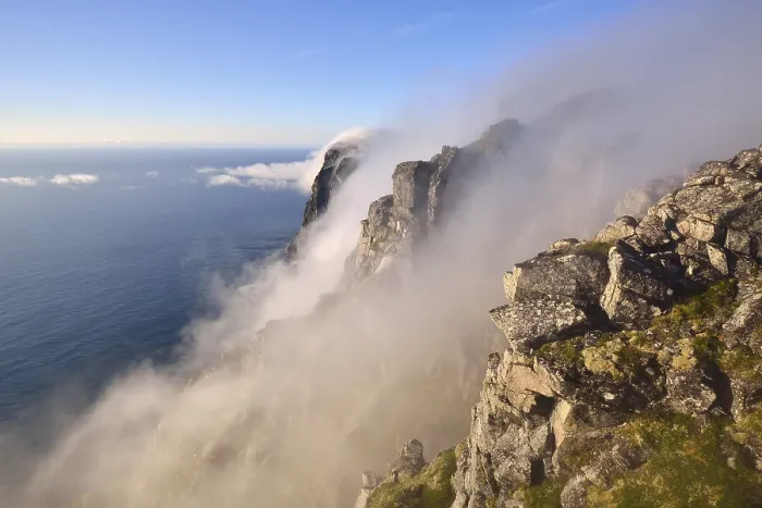 Framed Print : Fog falls down a steep cliff to the sea Framed Print : Fog falls down a steep cliff to the sea