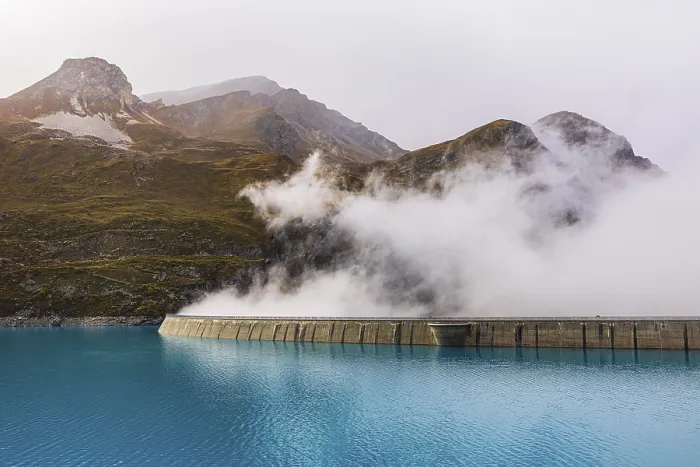 Framed Print : Fog rises over the dam of the Lac de Moiry Reservoir
