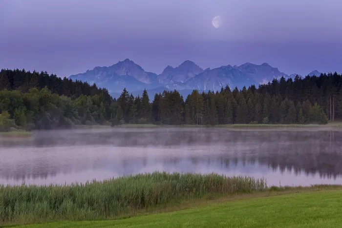 Framed Print : Foggy lake at dawn with visible mountains and forests