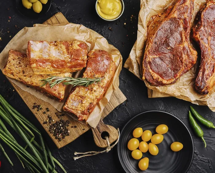 Framed Print : Food, Marinated pork steaks on cutting board and ingredients for cooking
