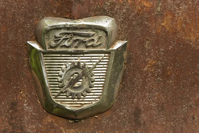 Framed Print : Ford Logo on a old car