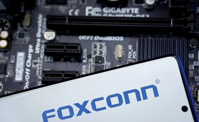 Framed Print : Foxconn company Logo on Smartphone