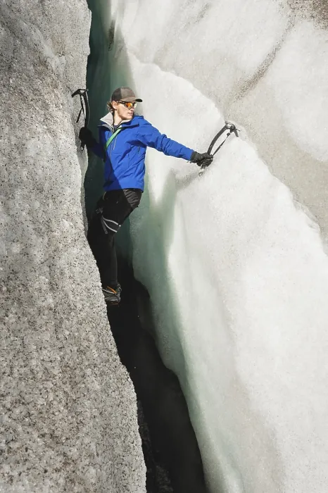 Framed Print : A free climber without insurance with two ice axes rises from a crack in the glacier Framed Print : A free climber without insurance with two ice axes rises from a crack in the glacier