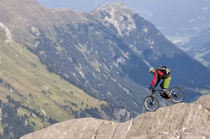 Framed Print : Freeride mountain biker with Liteville riding over cliff edge