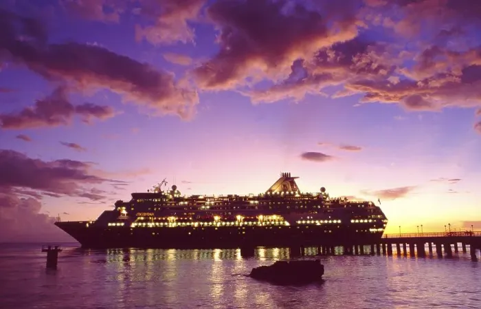 Framed Print : French Polynesia: An illuminated cruise ship anchored at the pier at sunset