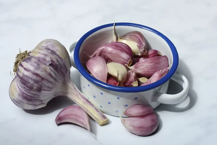 Framed Print : Fresh, red garlic cloves in pots Framed Print : Fresh, red garlic cloves in pots