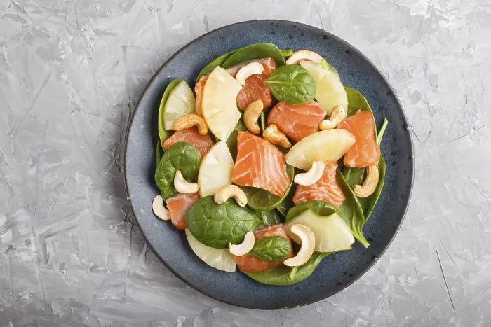 Framed Print : Fresh salmon with pineapple, spinach and cashew on a gray concrete background Framed Print : Fresh salmon with pineapple, spinach and cashew on a gray concrete background