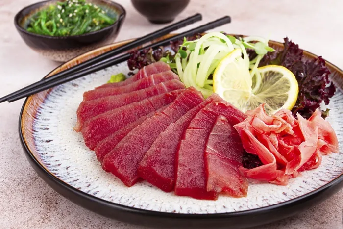 Framed Print : Freshly prepared sashimi with vibrant garnishes served on a decorative plate Framed Print : Freshly prepared sashimi with vibrant garnishes served on a decorative plate