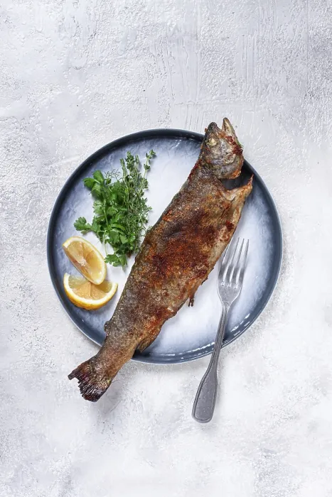 Framed Print : Fried rainbow trout, with herbs and citrus fruits
