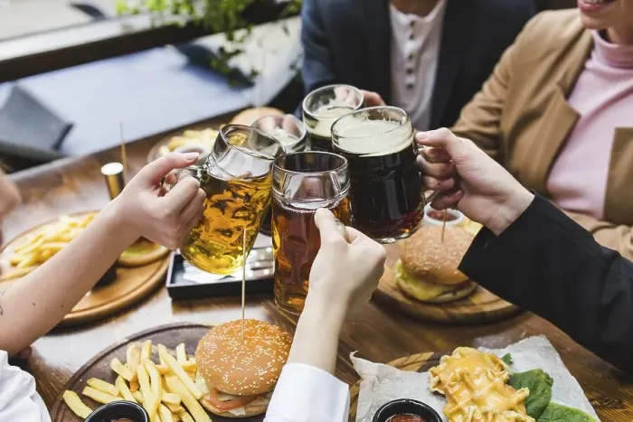 Framed Print : Friends toasting with beer restaurant
