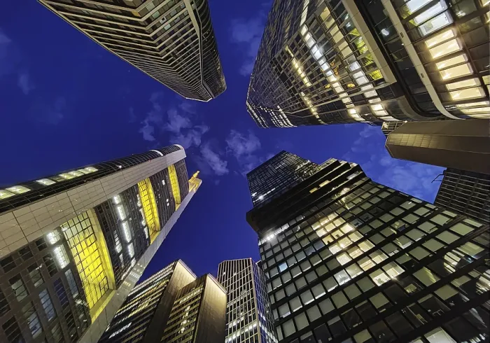 Framed Print : Frog's-eye view of skyscrapers in the banking district in the evening