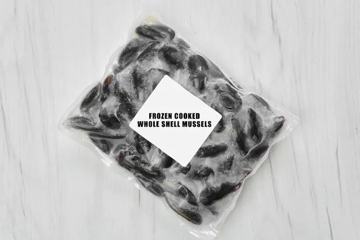 Framed Print : Frozen cooked whole shell mussels in package